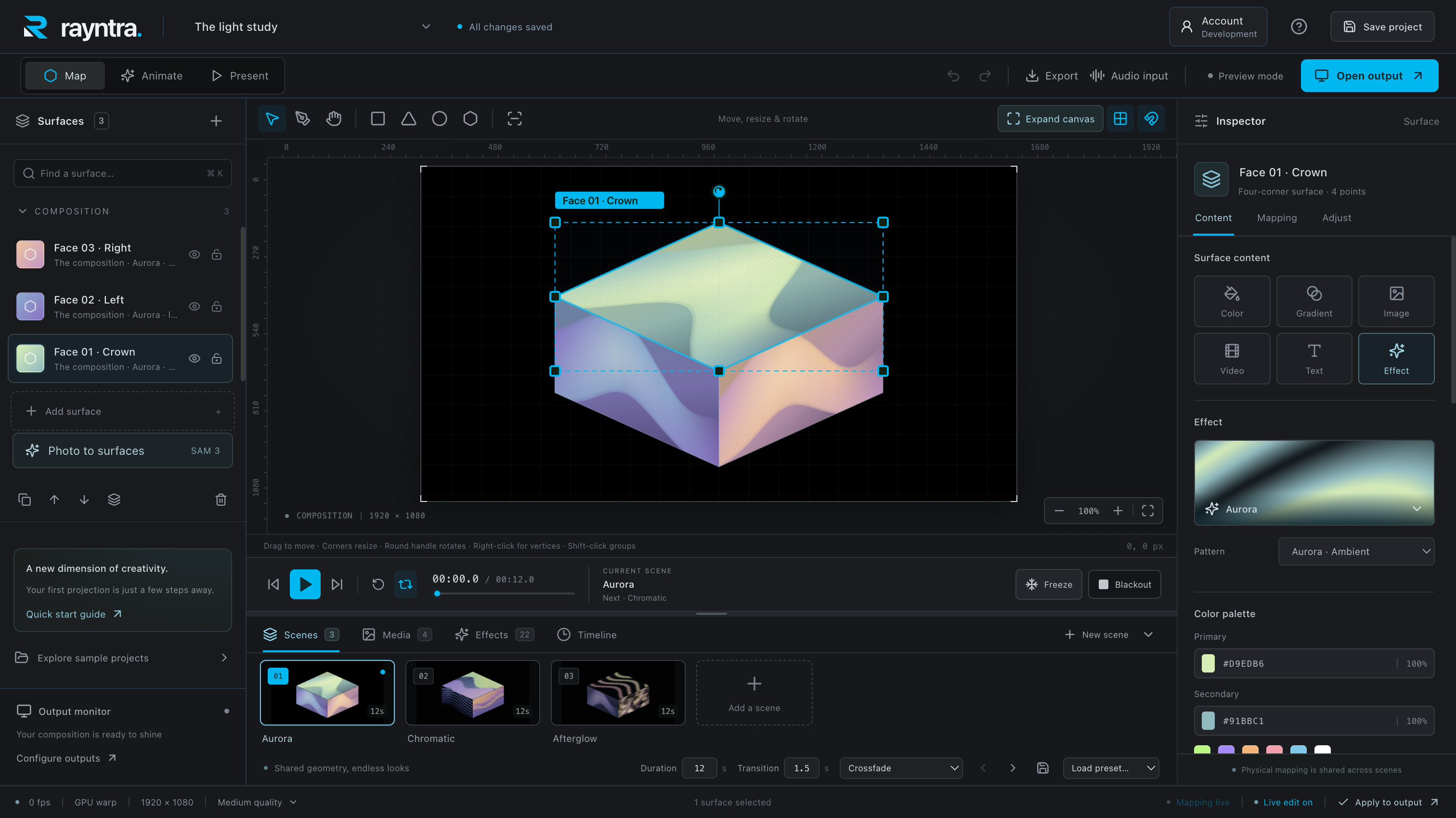 Rayntra desktop editor showing a mapped cube, visual layers, scene controls, and separate projector output controls.